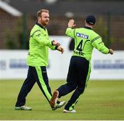 12 June 2019; Paul Stirling of Ireland is congratulated by Tyrone Kane after a catch during the 2nd T20 Cricket International match between Ireland and Zimbabwe at Bready Cricket Club in Magheramason, Co. Tyrone. Photo by Oliver McVeigh/Sportsfile