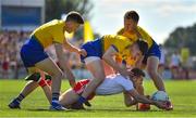 13 July 2019; Peter Harte of Tyrone is tackled by Ronan Daly, left, Conor Daly and Niall Daly of Roscommon during the GAA Football All-Ireland Senior Championship Quarter-Final Group 2 Phase 1 match between Roscommon and Tyrone at Dr Hyde Park in Roscommon. Photo by Brendan Moran/Sportsfile