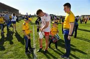 13 July 2019; Peter Harte of Tyrone signs an autograph for a Roscommon fan after the GAA Football All-Ireland Senior Championship Quarter-Final Group 2 Phase 1 match between Roscommon and Tyrone at Dr Hyde Park in Roscommon. Photo by Brendan Moran/Sportsfile