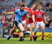 13 July 2019; Jack McCaffrey of Dublin shoots past Seán White of Cork to score the game's opening goal in the eleventh minute during the GAA Football All-Ireland Senior Championship Quarter-Final Group 2 Phase 1 match between Dublin and Cork at Croke Park in Dublin. Photo by Ray McManus/Sportsfile