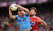 13 July 2019; Ciarán Kilkenny of Dublin catches the ball under pressure from Tomás Clancy of Cork during the GAA Football All-Ireland Senior Championship Quarter-Final Group 2 Phase 1 match between Dublin and Cork at Croke Park in Dublin. Photo by Ray McManus/Sportsfile