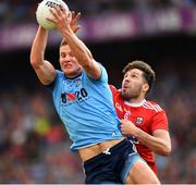 13 July 2019; Ciarán Kilkenny of Dublin catches the ball under pressure from Tomás Clancy of Cork during the GAA Football All-Ireland Senior Championship Quarter-Final Group 2 Phase 1 match between Dublin and Cork at Croke Park in Dublin. Photo by Ray McManus/Sportsfile