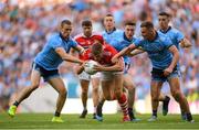 13 July 2019; Ian Maguire of Cork is tackled by Paul Mannion, left, and Ciarán Kilkenny of Dublin during the GAA Football All-Ireland Senior Championship Quarter-Final Group 2 Phase 1 match between Dublin and Cork at Croke Park in Dublin. Photo by Eóin Noonan/Sportsfile