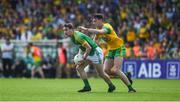 14 July 2019; Bryan McMahon of Meath in action against Michael Langan of Donegal during the GAA Football All-Ireland Senior Championship Quarter-Final Group 1 Phase 1 match between Donegal and Meath at MacCumhaill Park in Ballybofey, Donegal. Photo by Daire Brennan/Sportsfile