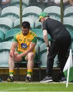 14 July 2019; Paddy McGrath of Donegal takes his seat in the dugout after injurying himself in the warm-up ahead of the GAA Football All-Ireland Senior Championship Quarter-Final Group 1 Phase 1 match between Donegal and Meath at MacCumhaill Park in Ballybofey, Donegal. Photo by Daire Brennan/Sportsfile