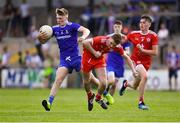 14 July 2019; Conor McKernan of Monaghan is tackled by Shea Daly of Tyrone, as Steven Donaghy of Tyrone, right, looks on during the Electric Ireland Ulster GAA Football Minor Championship Final match between Monaghan and Tyrone at Athletic Grounds in Armagh. Photo by Piaras Ó Mídheach/Sportsfile