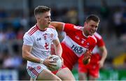 14 July 2019; Conall Grimes of Tyrone in action against Ruairí Gormley of Derry during the EirGrid Ulster GAA Football U20 Championship Final match between Derry and Tyrone at Athletic Grounds in Armagh. Photo by Piaras Ó Mídheach/Sportsfile