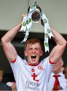 14 July 2019; Tyrone captain Ruairí Gormley lifts the Corn Dónall Ó Murchú after the EirGrid Ulster GAA Football U20 Championship Final match between Derry and Tyrone at Athletic Grounds in Armagh. Photo by Piaras Ó Mídheach/Sportsfile