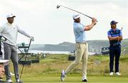 15 July 2019; Dustin Johnson of USA watches his tee shot on the 17th hole, with Tiger Woods, left, of USA, and Rickie Fowler of USA during a practice round ahead of the 148th Open Championship at Royal Portrush in Portrush, Co. Antrim. Photo by Ramsey Cardy/Sportsfile