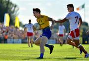 13 July 2019; Tadgh O'Rourke of Roscommon in action against Michael McKernan of Tyrone during the GAA Football All-Ireland Senior Championship Quarter-Final Group 2 Phase 1 match between Roscommon and Tyrone at Dr Hyde Park in Roscommon. Photo by Brendan Moran/Sportsfile