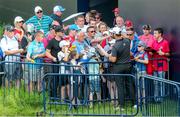 15 July 2019; Jon Rahm of Spain signs autographs following a practice round ahead of the 148th Open Championship at Royal Portrush in Portrush, Co. Antrim. Photo by John Dickson/Sportsfile