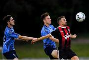 15 July 2019; Keith Ward of Bohemians in action against Evan Farrell, left, and Harry McEvoy of UCD during the SSE Airtricity League Premier Division match between UCD and Bohemians at UCD Bowl in Dublin. Photo by Seb Daly/Sportsfile