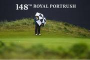 17 July 2019; A steward has trouble with his umbrella on the 18th green during a practice round ahead of the 148th Open Championship at Royal Portrush in Portrush, Co. Antrim. Photo by Ramsey Cardy/Sportsfile