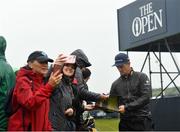 17 July 2019; Justin Rose of England signs autographs during a practice round ahead of the 148th Open Championship at Royal Portrush in Portrush, Co. Antrim. Photo by Ramsey Cardy/Sportsfile