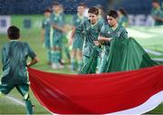 17 July 2019; Flag-bearers get wet from the pitch sprinklers prior to the 2019 UEFA European U19 Championships group A match between Armenia and Italy at Vazgen Sargsyan Republican Stadium in Yerevan, Armenia. Photo by Stephen McCarthy/Sportsfile