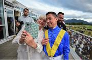 17 July 2019; Racegoer Dymphna Fagan takes a selfie with Jockey Frankie Dettori during day 3 of the Killarney Racing Festival at Killarney Racecourse in Kerry. Photo by David Fitzgerald/Sportsfile