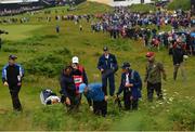18 July 2019; Rory McIlroy of Northern Ireland tries to find his ball on the 1st hole during Day One of the 148th Open Championship at Royal Portrush in Portrush, Co Antrim. Photo by Ramsey Cardy/Sportsfile