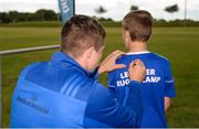 18 July 2019; Leinster player Scott Penny with participants during the Bank of Ireland Leinster Rugby Summer Camp at Seapoint Rugby Club in Glenageary, Dublin. Photo by Harry Murphy/Sportsfile