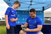 18 July 2019; Leinster player Peter Dooley signs a can of baked beans for a participant during the Bank of Ireland Leinster Rugby Summer Camp at Portlaoise RFC in Portlaoise, Co Laois. Photo by Sam Barnes/Sportsfile