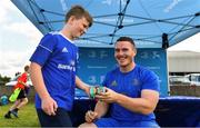 18 July 2019; Leinster player Peter Dooley signs a can of baked beans for a participant during the Bank of Ireland Leinster Rugby Summer Camp at Portlaoise RFC in Portlaoise, Co Laois. Photo by Sam Barnes/Sportsfile