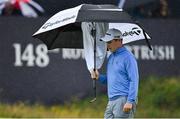 18 July 2019; Robert MacIntyre of Scotland keeps his putter dry on the 18th green during Day One of the 148th Open Championship at Royal Portrush in Portrush, Co Antrim. Photo by Brendan Moran/Sportsfile