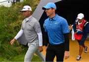 18 July 2019; Rory McIlroy of Northern Ireland, right, with Gary Woodland of USA during Day One of the 148th Open Championship at Royal Portrush in Portrush, Co Antrim. Photo by Ramsey Cardy/Sportsfile