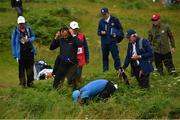 18 July 2019; Rory McIlroy of Northern Ireland searches for the ball on the 1st hole during Day One of the 148th Open Championship at Royal Portrush in Portrush, Co Antrim. Photo by Ramsey Cardy/Sportsfile