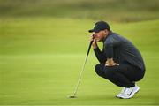 18 July 2019; Brooks Koepka of USA lines up a putt on the 16th green during Day One of the 148th Open Championship at Royal Portrush in Portrush, Co Antrim. Photo by Ramsey Cardy/Sportsfile
