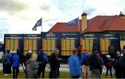 18 July 2019; Spectators look at the scoreboard during Day One of the 148th Open Championship at Royal Portrush in Portrush, Co Antrim. Photo by Ramsey Cardy/Sportsfile