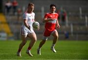 14 July 2019; Conall Devlin of Tyrone in action against Conleth McShane of Derry during the EirGrid Ulster GAA Football U20 Championship Final match between Derry and Tyrone at Athletic Grounds in Armagh. Photo by Piaras Ó Mídheach/Sportsfile