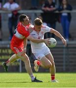 14 July 2019; Conall Grimes of Tyrone is tackled by Padraig McGrogan of Derry during the EirGrid Ulster GAA Football U20 Championship Final match between Derry and Tyrone at Athletic Grounds in Armagh. Photo by Piaras Ó Mídheach/Sportsfile