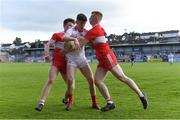 14 July 2019; Aidan Clarke of Tyrone in action against Ethan Doherty, left, and Declan Cassidy of Derry during the EirGrid Ulster GAA Football U20 Championship Final match between Derry and Tyrone at Athletic Grounds in Armagh. Photo by Piaras Ó Mídheach/Sportsfile