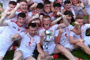 14 July 2019; Tyrone captain Ruairí Gormley, centre, and his team-mate celebrate with the Corn Dónall Ó Murchú after the EirGrid Ulster GAA Football U20 Championship Final match between Derry and Tyrone at Athletic Grounds in Armagh. Photo by Piaras Ó Mídheach/Sportsfile
