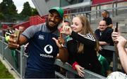 19 July 2019; Bundee Aki poses for a photo with fans following an Ireland Rugby open training session at Thomond Park in Limerick. Photo by David Fitzgerald/Sportsfile