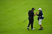19 July 2019; Shane Lowry of Ireland celebrates with caddy Brian Martin on the 18th green after finishing their round during Day Two of the 148th Open Championship at Royal Portrush in Portrush, Co Antrim. Photo by Brendan Moran/Sportsfile