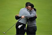 19 July 2019; Rory McIlroy of Northern Ireland is embraced by Gary Woodland of USA on the 18th green after finishing their rounds during Day Two of the 148th Open Championship at Royal Portrush in Portrush, Co Antrim. Photo by Brendan Moran/Sportsfile