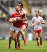 20 July 2019; Killian O'Hanlon of Cork is tackled by Colm Cavanagh of Tyrone during the GAA Football All-Ireland Senior Championship Quarter-Final Group 2 Phase 2 match between Cork and Tyrone at Croke Park in Dublin. Photo by David Fitzgerald/Sportsfile