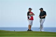20 July 2019; Shane Lowry of Ireland and his caddy Brian Martin wait for JB Holmes of USA on the 5th green during Day Three of the 148th Open Championship at Royal Portrush in Portrush, Co Antrim. Photo by Brendan Moran/Sportsfile
