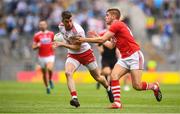 20 July 2019; Richard Donnelly of Tyrone in action against Ian Magure of Cork  during the GAA Football All-Ireland Senior Championship Quarter-Final Group 2 Phase 2 match between Cork and Tyrone at Croke Park in Dublin. Photo by David Fitzgerald/Sportsfile