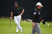 20 July 2019; Shane Lowry of Ireland looks on as JB Holmes of USA walks by on the 12th green during Day Three of the 148th Open Championship at Royal Portrush in Portrush, Co Antrim. Photo by Brendan Moran/Sportsfile