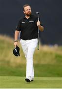 20 July 2019; Shane Lowry of Ireland acknowledges the gallery as he walks up to the 18th green during Day Three of the 148th Open Championship at Royal Portrush in Portrush, Co Antrim. Photo by Ramsey Cardy/Sportsfile