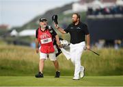 20 July 2019; Shane Lowry of Ireland with his caddy Brian Martin as they make their way to the 18th green during Day Three of the 148th Open Championship at Royal Portrush in Portrush, Co Antrim. Photo by Ramsey Cardy/Sportsfile