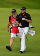 20 July 2019; Shane Lowry of Ireland with his caddy Brian Martin as they make their way to the 18th green during Day Three of the 148th Open Championship at Royal Portrush in Portrush, Co Antrim. Photo by Brendan Moran/Sportsfile