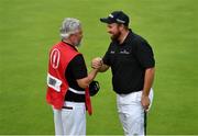 20 July 2019; Shane Lowry of Ireland celebrates with his caddy Brian Martin on the 18th green after finishing his round during Day Three of the 148th Open Championship at Royal Portrush in Portrush, Co Antrim. Photo by Brendan Moran/Sportsfile