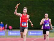 20 July 2019; Cathal Crosbie of Ennis Track AC celebrates after leading his team home to win the Men's Division 1 4x400m relay from second place Chris St Clare Johnson of the Wexford County team during the AAI National League Final at Tullamore Harriers Stadium in Tullamore, Co. Offaly. Photo by Matt Browne/Sportsfile