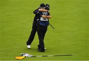 21 July 2019; Shane Lowry of Ireland celebrates with caddy Brian Martin on the 18th green after winning The Open Championship during Day Four of the 148th Open Championship at Royal Portrush in Portrush, Co Antrim. Photo by Brendan Moran/Sportsfile