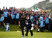 21 July 2019; Shane Lowry of Ireland celebrates with his caddy Brian Martin his way to the 18th green during Day Four of the 148th Open Championship at Royal Portrush in Portrush, Co Antrim. Photo by Ramsey Cardy/Sportsfile