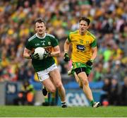 21 July 2019; Tom O'Sullivan of Kerry races clear of Eoin McHugh of Donegal during the GAA Football All-Ireland Senior Championship Quarter-Final Group 1 Phase 2 match between Kerry and Donegal at Croke Park in Dublin. Photo by Ray McManus/Sportsfile