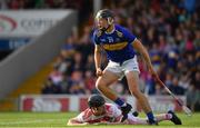 23 July 2019; Kian O'Kelly of Tipperary celebrates after scoring their side’s second goal as Ger Collins of Cork looks on during the Bord Gais Energy Munster GAA Hurling Under 20 Championship Final match between Tipperary and Cork at Semple Stadium in Thurles, Co Tipperary. Photo by Sam Barnes/Sportsfile