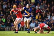 23 July 2019; Kian O'Kelly of Tipperary in action against against James Keating, left, and Sean O'Leary Hayes of Cork on his way to scoring his side's second goal during the Bord Gais Energy Munster GAA Hurling Under 20 Championship Final match between Tipperary and Cork at Semple Stadium in Thurles, Co Tipperary. Photo by Sam Barnes/Sportsfile